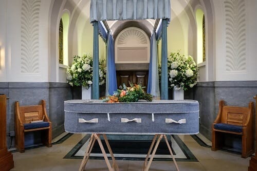 Burial vs Cremation - Coffin in a Church