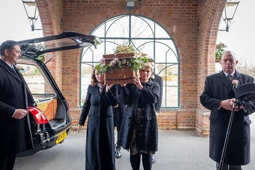 Funeral with Casket and Pall Bearers