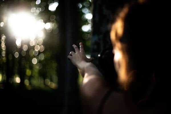 Child Reaching for Ray of Sun